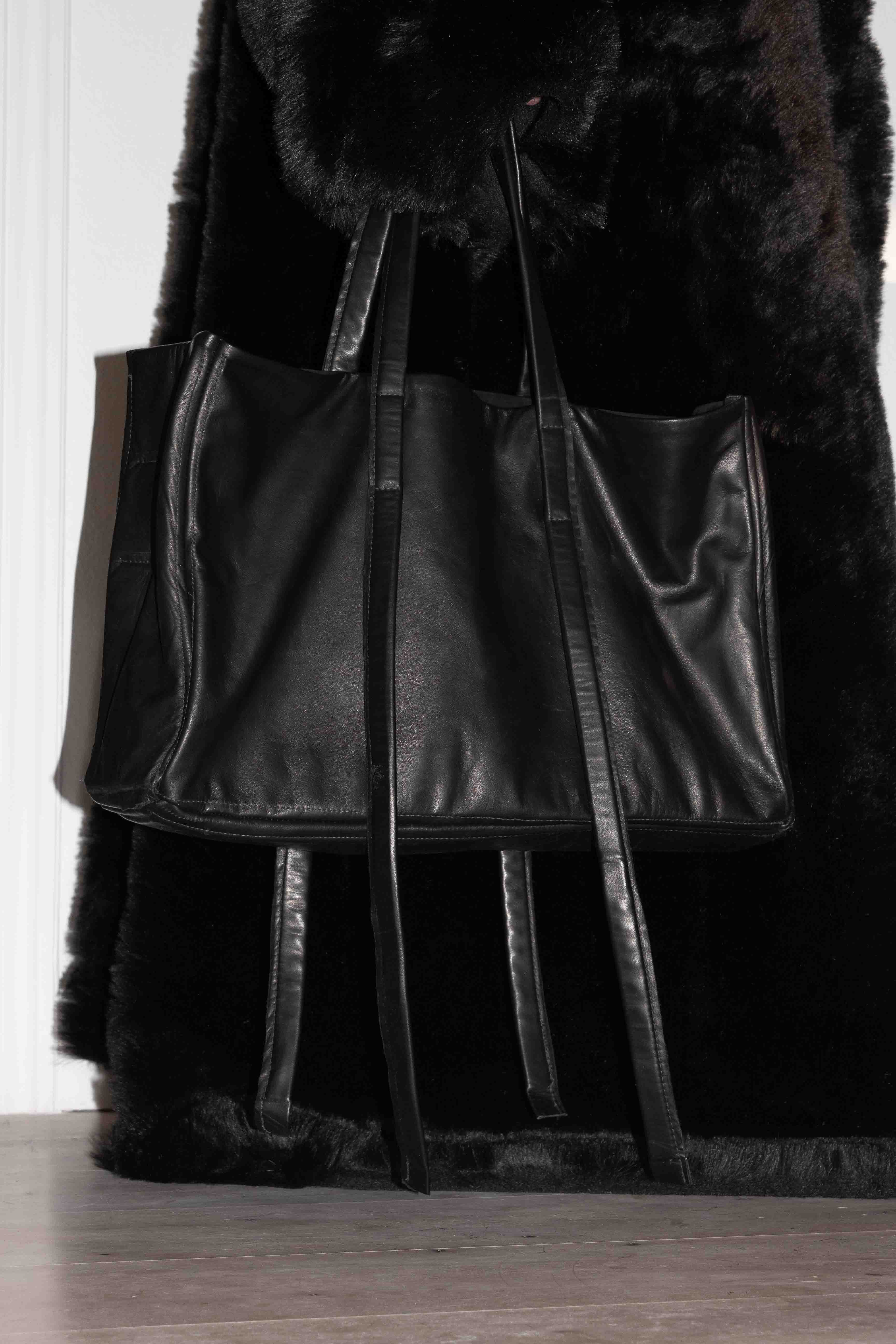 Horse leather tote bag worn against dark fur coat showing scale and styling possibilities