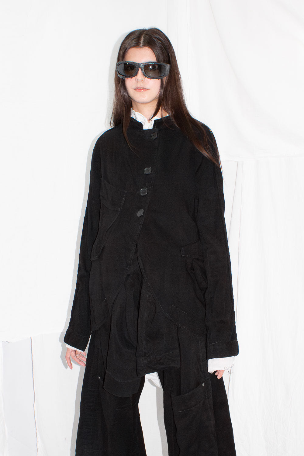 Model front view wearing jacket with white shirt underneath, showing full styling