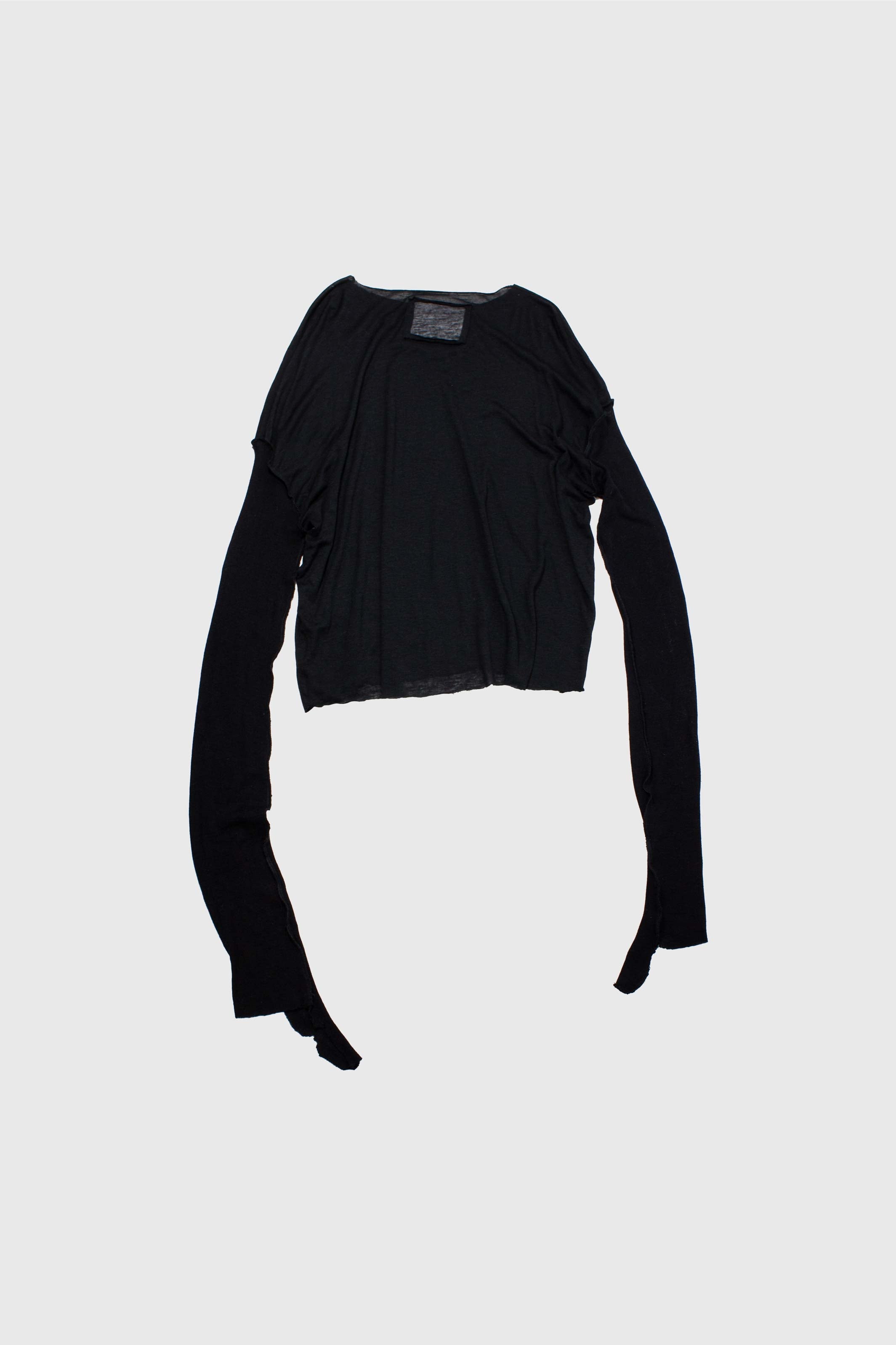 Black silk long-sleeve laid flat showing cropped body and extremely extended sleeves