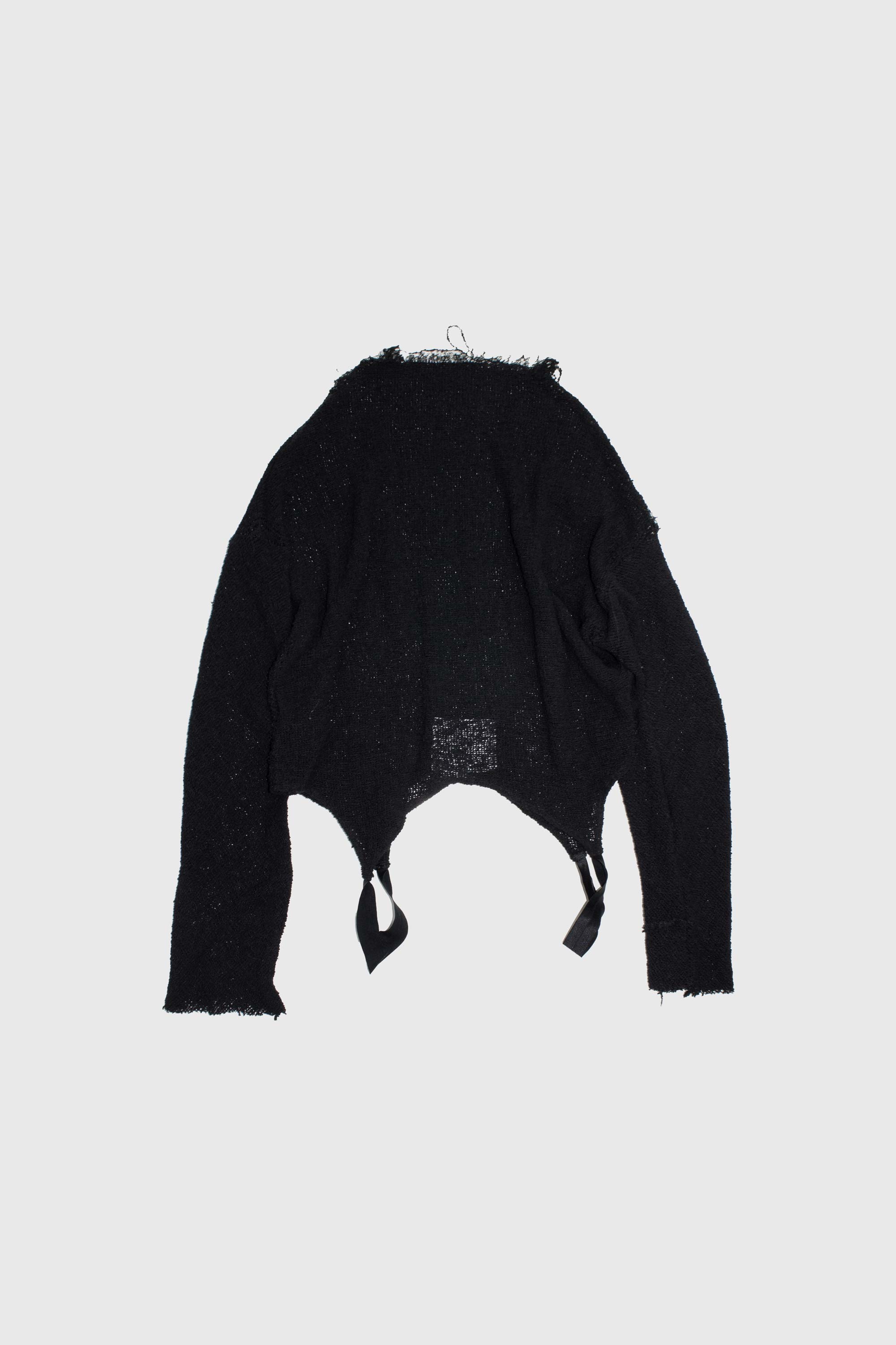 Back view of mesh sweater laid flat showing raw edges and open knit construction with hanger