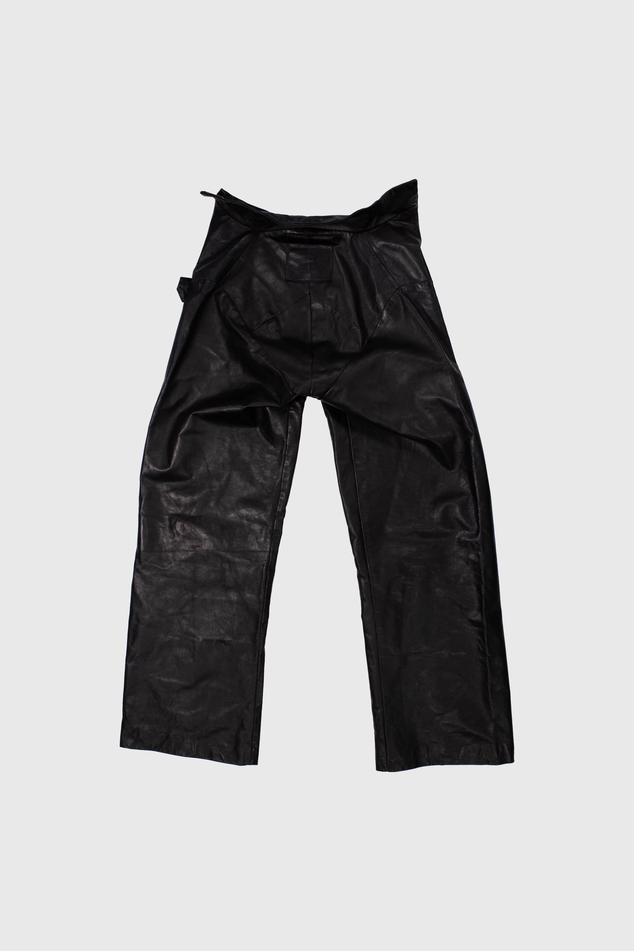 Leather trousers laid flat showing full construction and paneled details