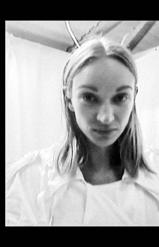 NELLY JOHANSSON 2023–24 collection: black-and-white portrait, slicked hair and white high-neck top 7