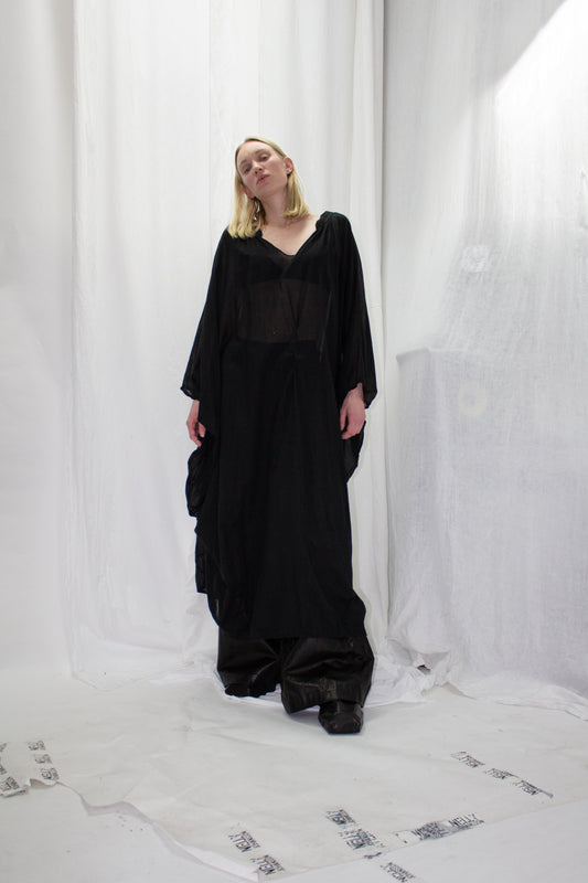 NELLY JOHANSSON 2023–24 collection: long black tunic dress over wide trousers 8
