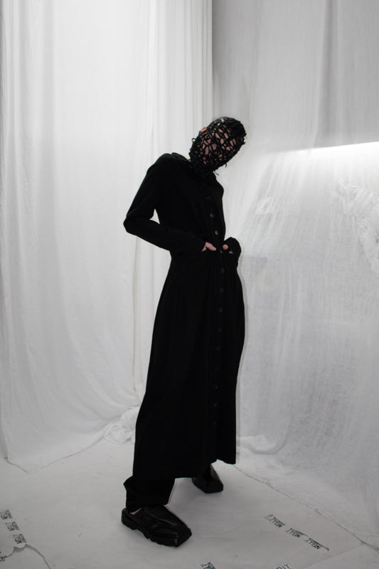 NELLY JOHANSSON 2023–24 collection: masked model in an all-black look with wide trousers 14