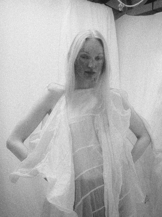 NELLY JOHANSSON 2023–24 collection: black-and-white portrait in a white sheer draped top 17