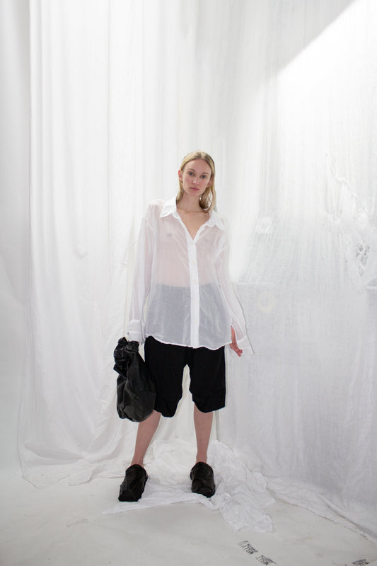 NELLY JOHANSSON 2023–24 collection: sheer white shirt with black shorts and a black bag 18