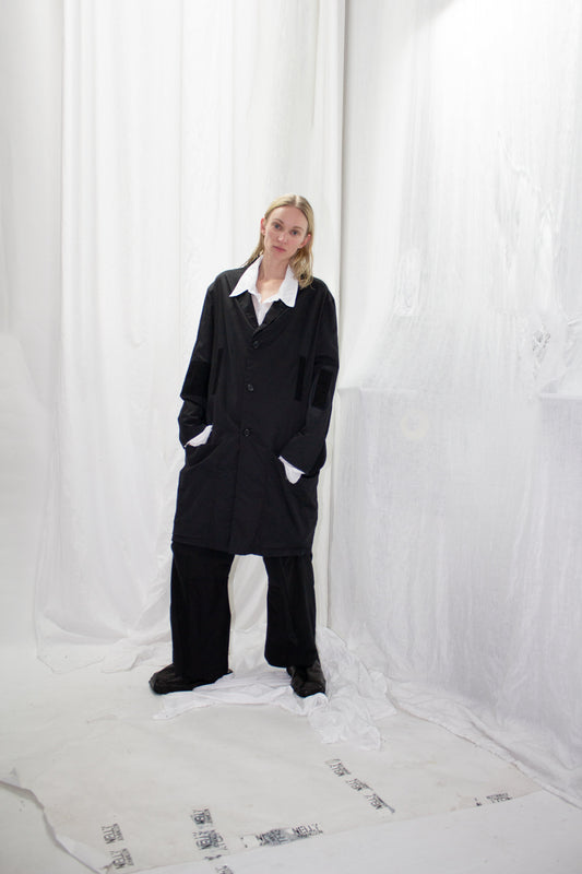 NELLY JOHANSSON 2023–24 collection: black tailored jacket with white collar and black trousers 21