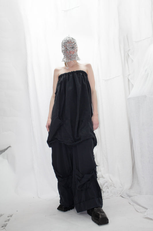 NELLY JOHANSSON 2023–24 collection: masked model in a black strapless top and wide black trousers 22