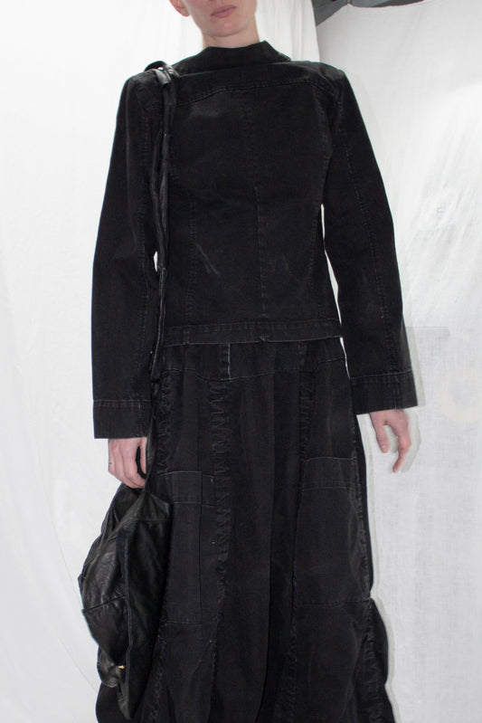NELLY JOHANSSON 2023–24 collection: black high-neck jacket with a black maxi skirt 30