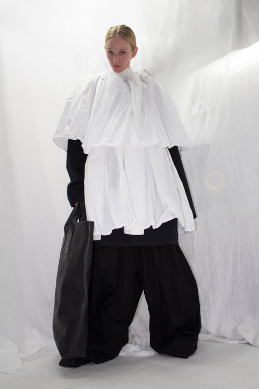 NELLY JOHANSSON 2023–24 collection: white cape-collar shirt with wide black trousers 31