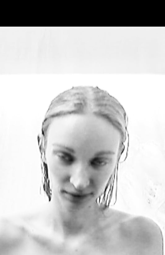 NELLY JOHANSSON 2023–24 collection: portrait with slicked hair and a white top 35