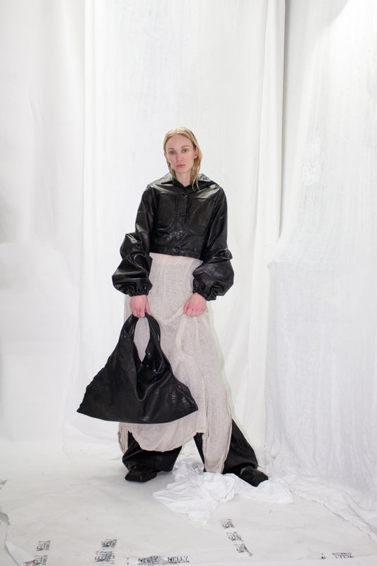 NELLY JOHANSSON 2023–24 collection: black leather jacket with a white skirt and bag 37