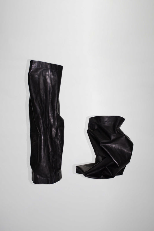 NELLY JOHANSSON 2023–24 collection: pair of black leather boot legs, still life 51