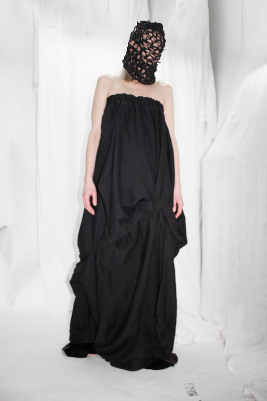 NELLY JOHANSSON 2023–24 collection: masked model in a black strapless dress with draped skirt 52
