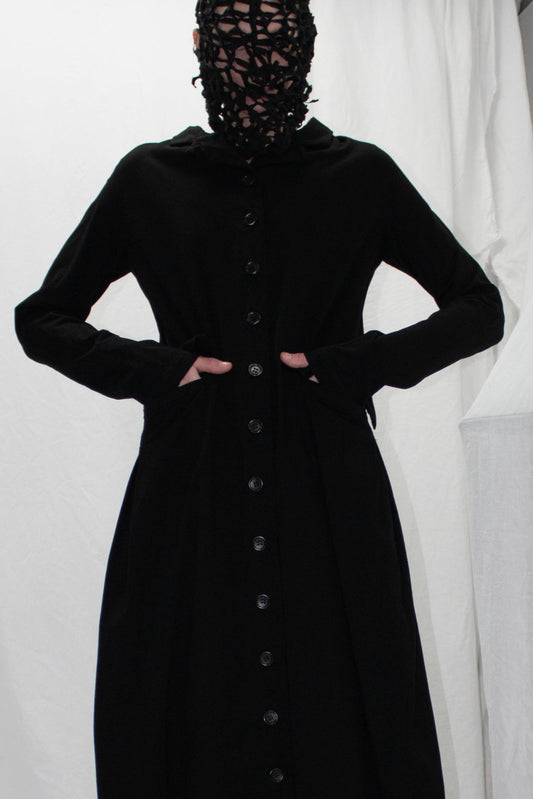 NELLY JOHANSSON 2023–24 collection: masked model in a long black button-front dress 58