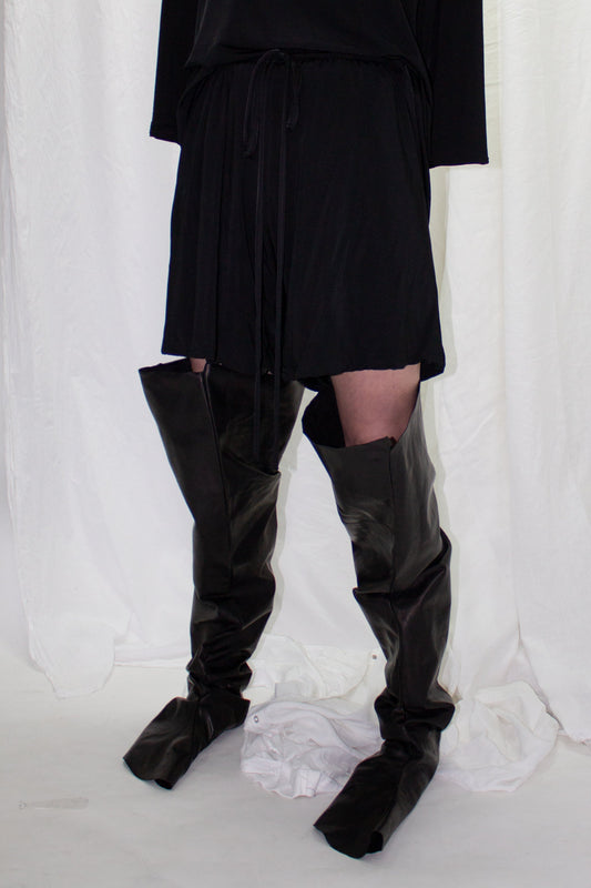 NELLY JOHANSSON 2023–24 collection: black shorts with black leather boot legs 59