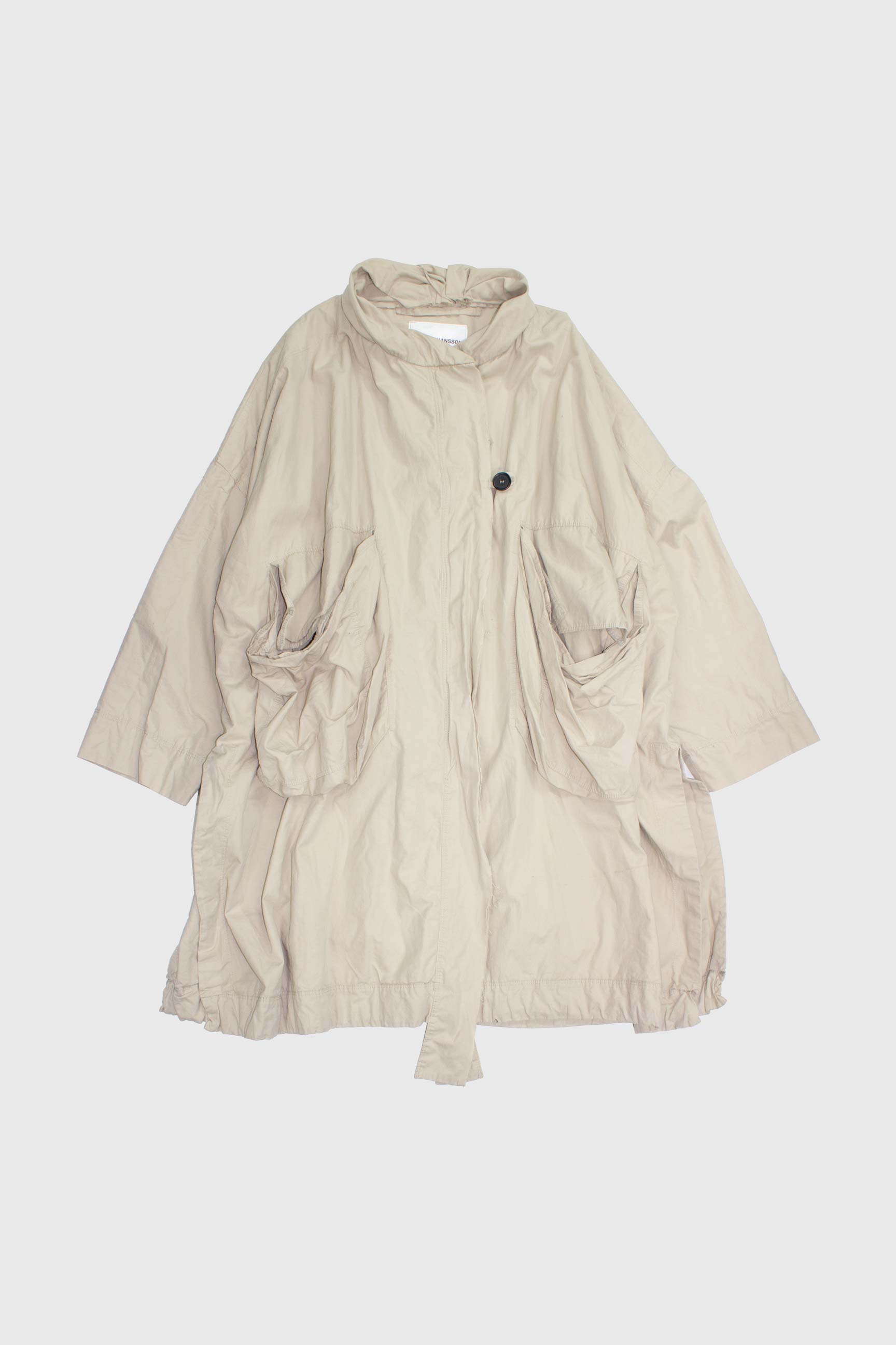 Beige oversized cotton parka flat lay with hooded funnel neck and large draped pockets