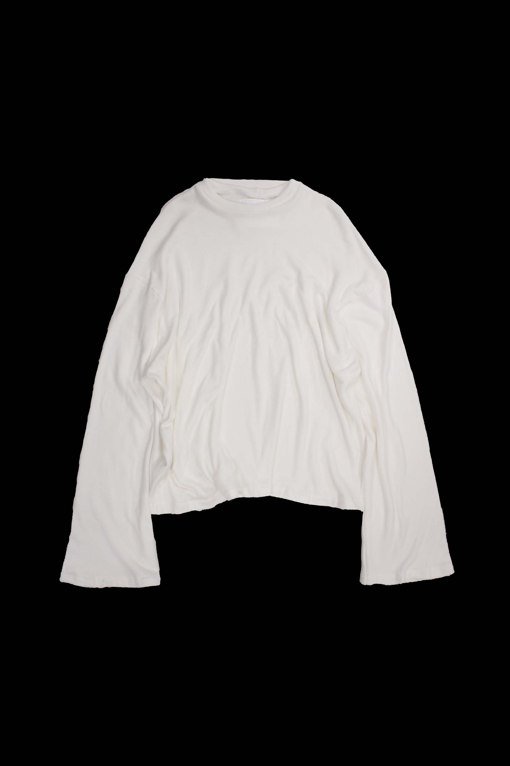 White crew neck sweater laid flat showing dropped shoulder construction