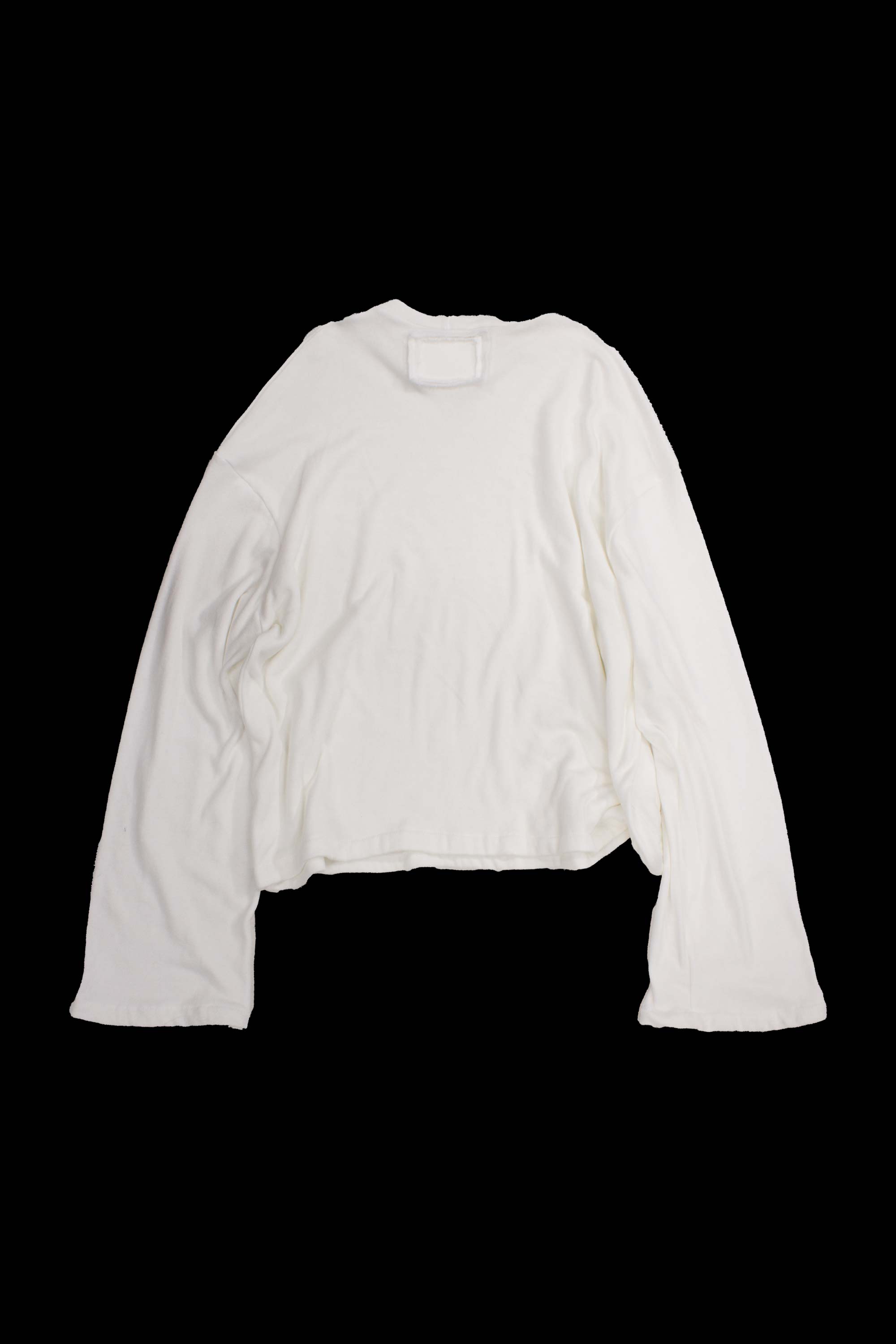 White sweater back view showing crew neckline and dropped shoulder seaming