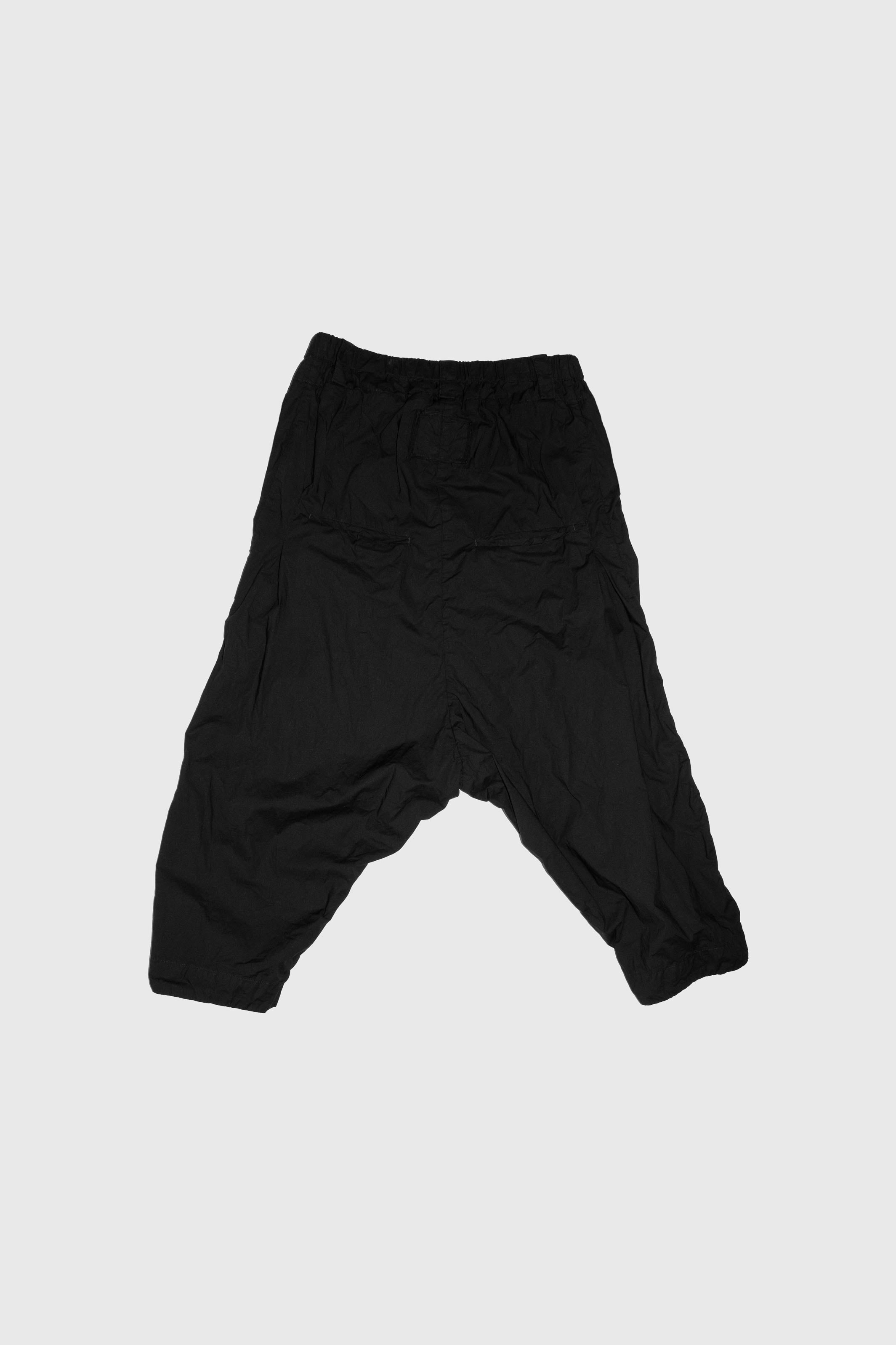 Back view flat lay showing random pleat placement and elasticized waistband construction