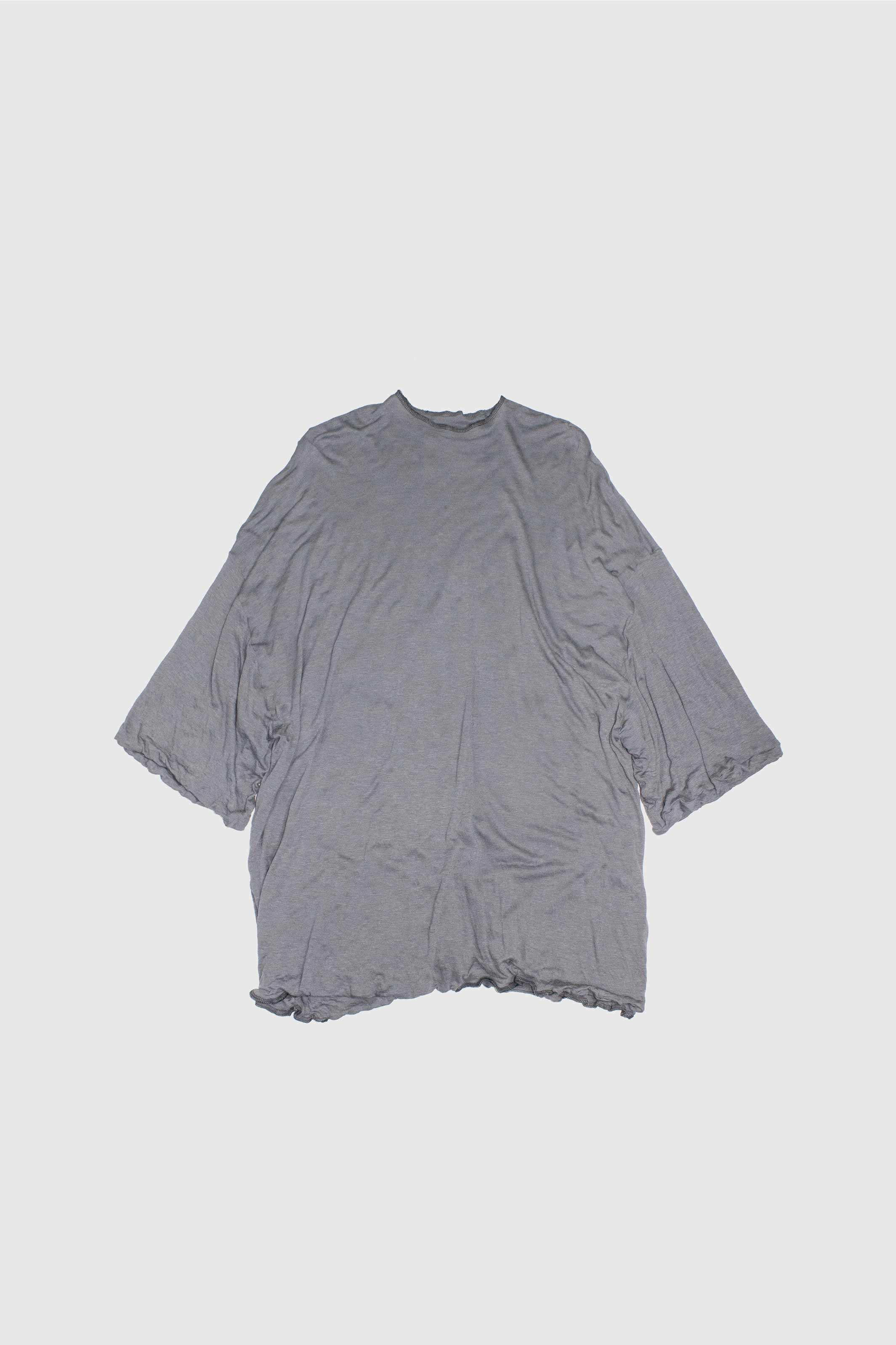 Grey double-layered t-shirt flat lay showing oversized silhouette and wide sleeves